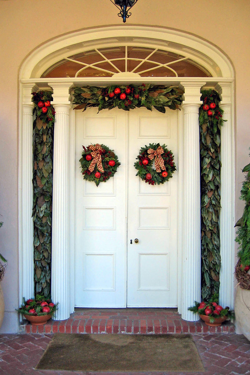 Lovely white doors with tidy Christmas wreathes at the entry to the Oak Alley Plantation mansion.