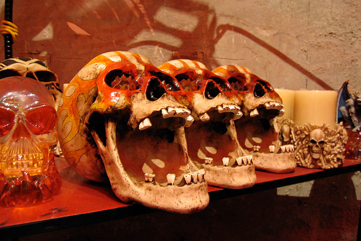 Artificial skulls painted with flames on top.