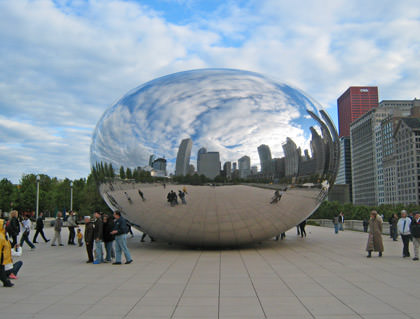 Cloud Gate sculpture... a giant 'coffee bean' shape with a mirrored surface reflecting the Chicago city skyline.