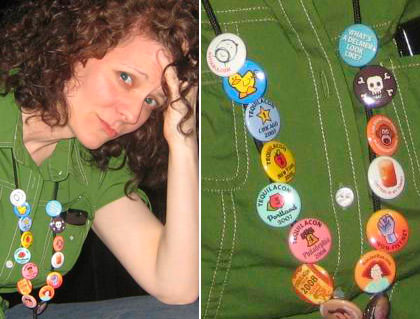 Jenny wearing buttons that have been pinned to her name badge lanyard.