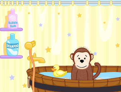 Webkinz monkey taking a bath with his rubber ducky.