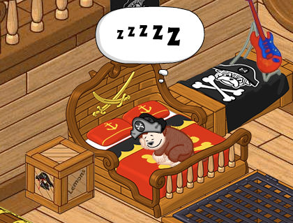 Webkinz monkey sleeping on his pirate-themed bed.