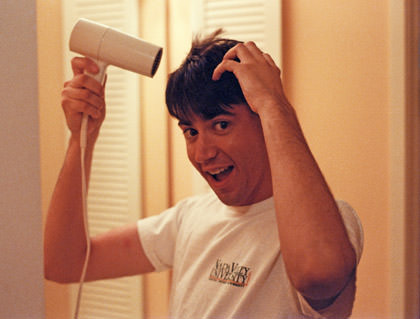 Dave drying his hair with a hair dryer, back when he had lots of hair.