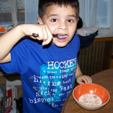 Puppy Monster eating cereal.