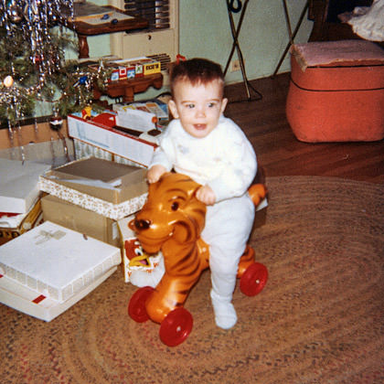 Baby Dave Rides a Plastic Tiger