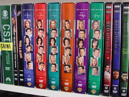 All the sets of Freinds episodes on DVD sets neatly lined up on a shelf.