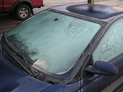 Frost covering all the windows of my car.