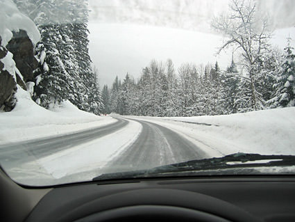 Me driving on a very snowy road.