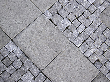 Concrete tiles in a sidewalk.