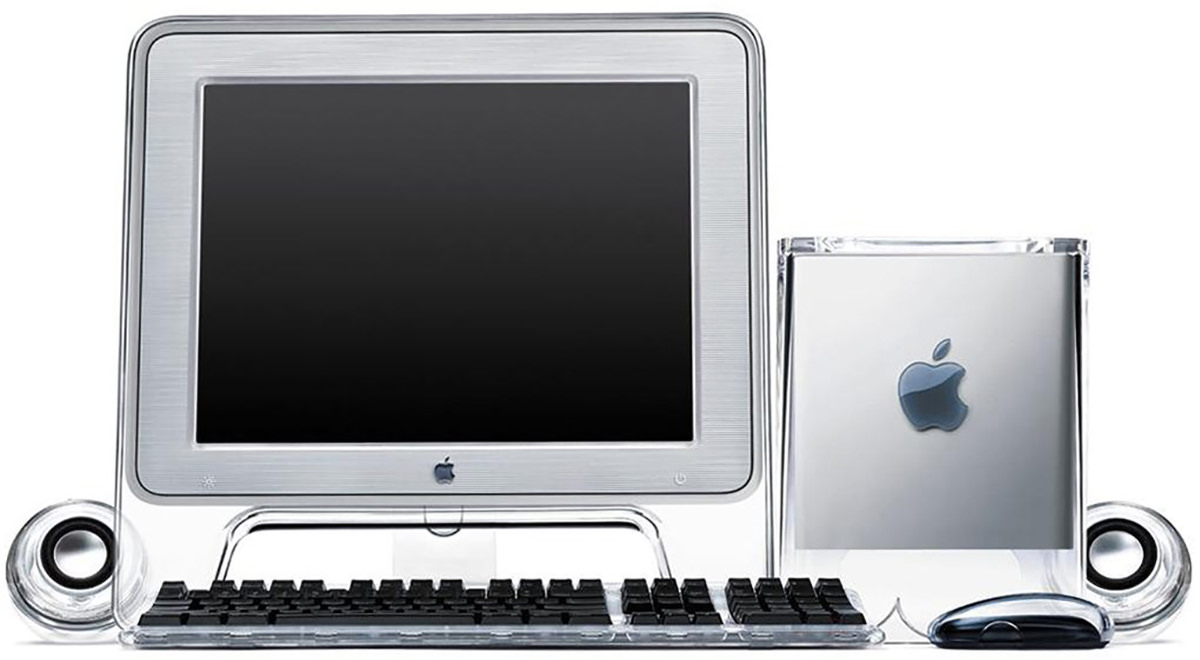 The Macintosh G4 Cube computer next to a matching monitor and keyboard.