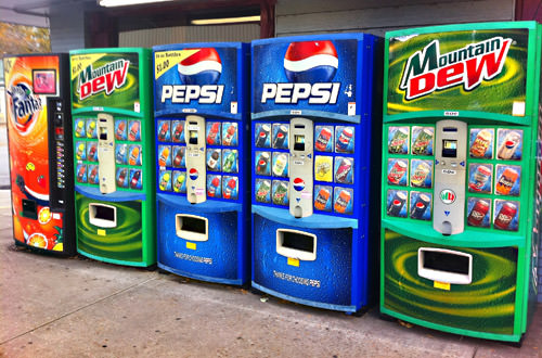 Soda machines lined up in front of the Woodbury Pharmacy!