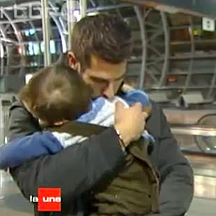 Laurent Ghilain hugs his son Samuel