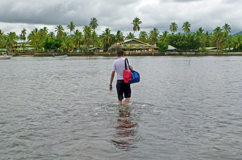 The guy ahead of me trudging back to the SCUBA shop in Fiji through the water.