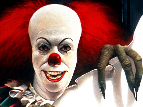 Tim Curry as Pennywise in IT