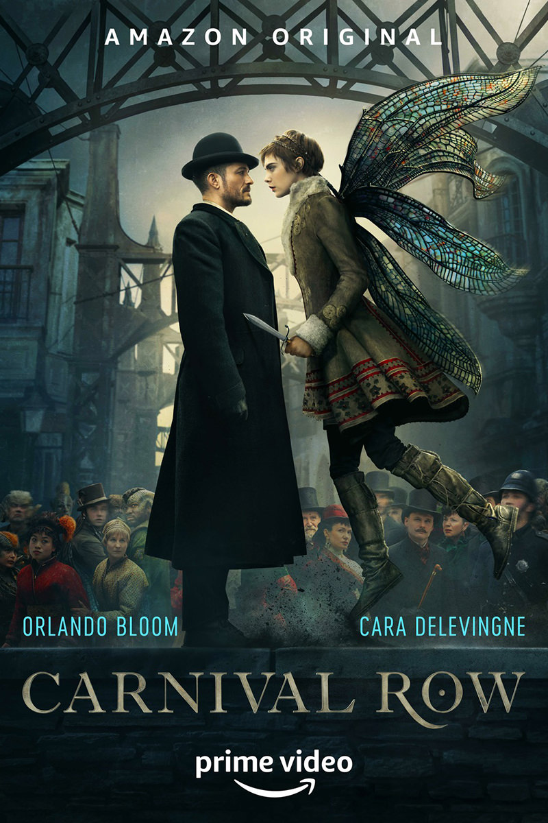 A poster for Carnival Row showing an industrial Victorian background with Orlando Bloom in formal wear being confronted by a woman with dragonfly wings hovering before him.