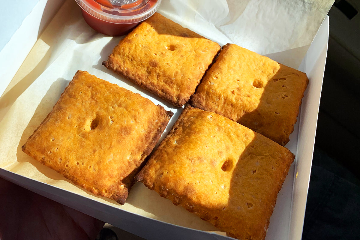 Four big squares that look like inflated orange Cheez-It crackers.