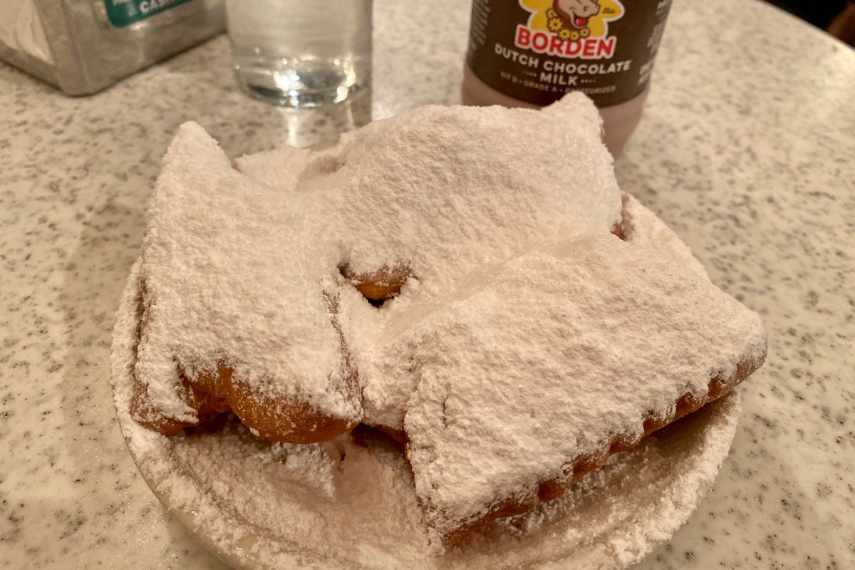 Beignets... square donuts caked with way too much powdered sugar.