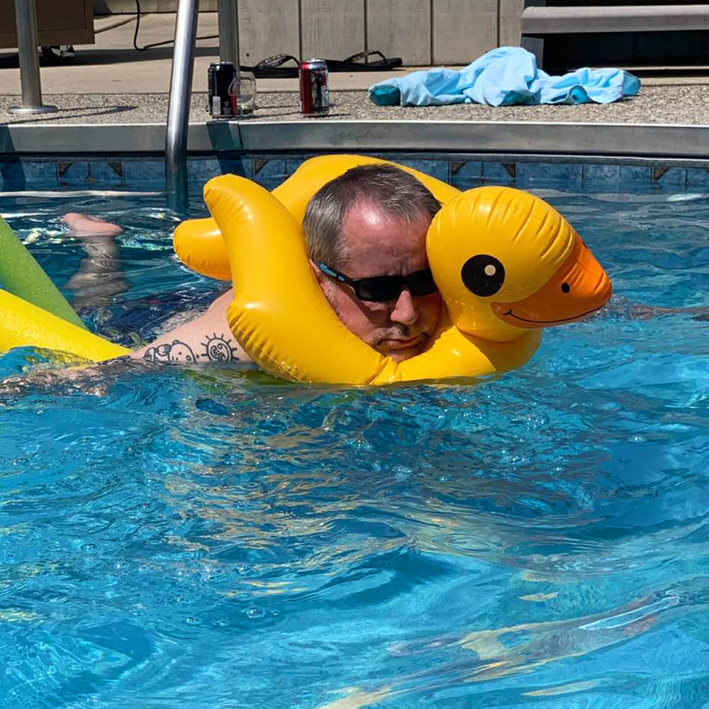 Dave in a Pool with a Duck Floaty