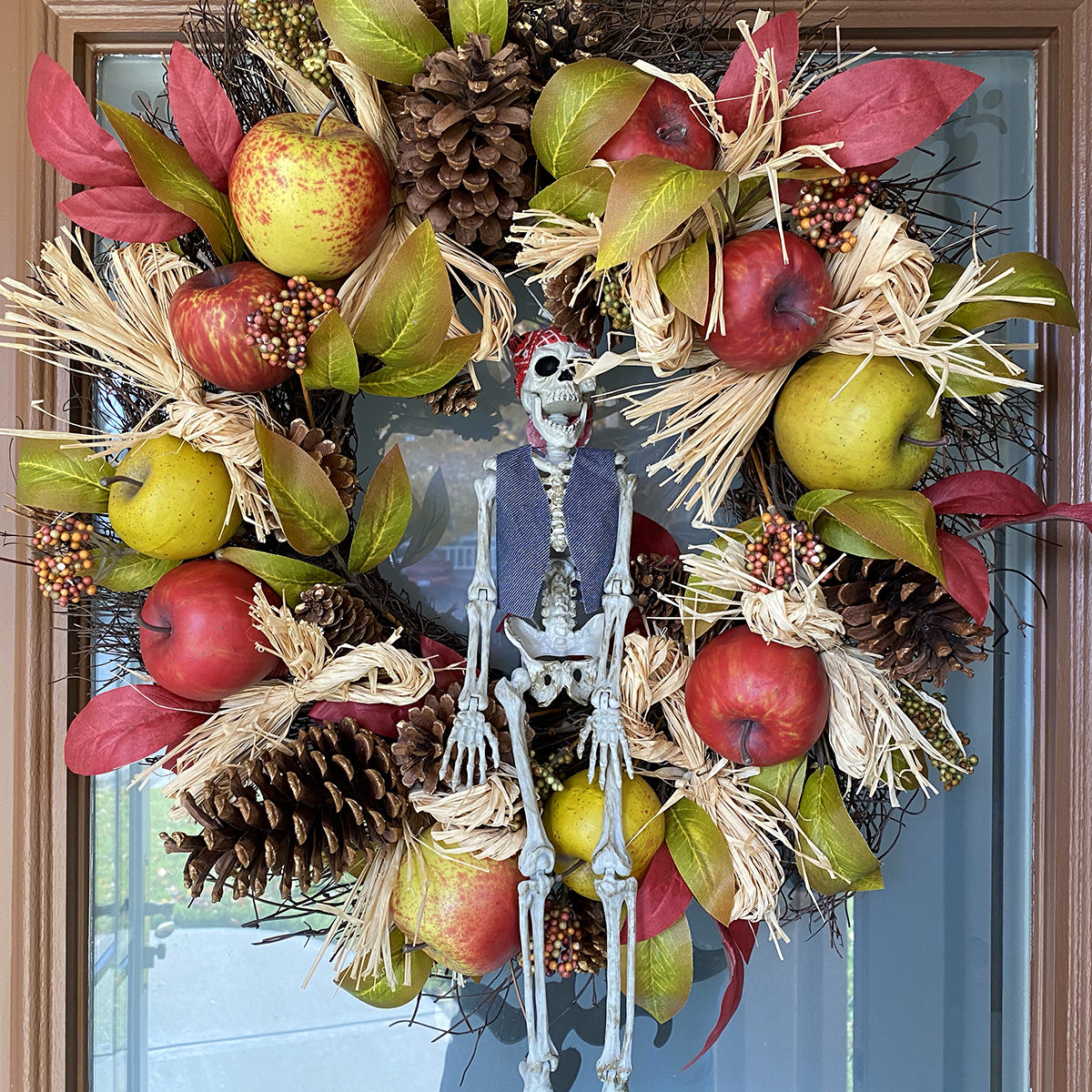 A wreath on my door filled with fake apples, real pinecones, and other Fall-apropriate stuff... with a pirate skeleton in the middle.