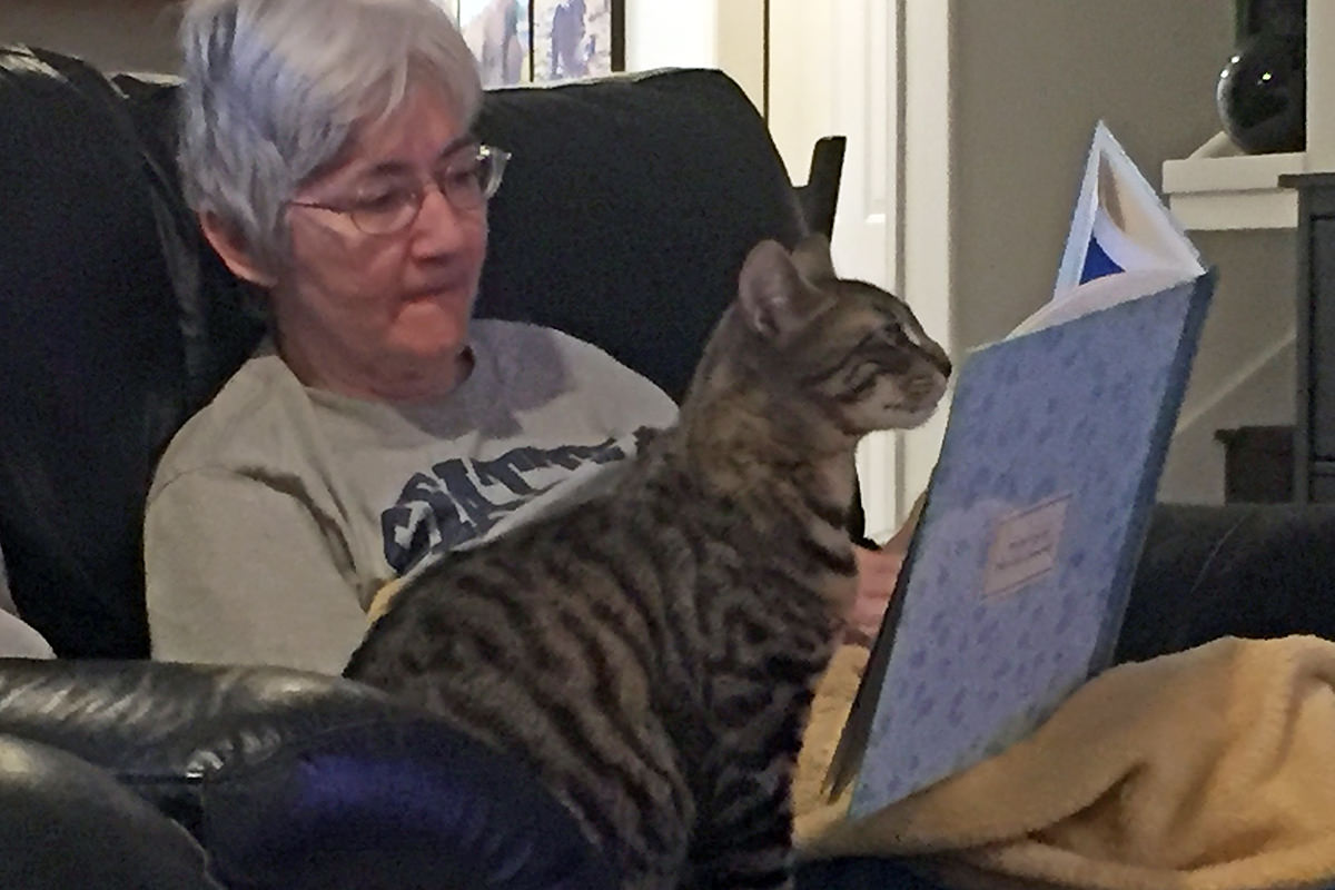 Mom Reading Her Travel Book with Jake!