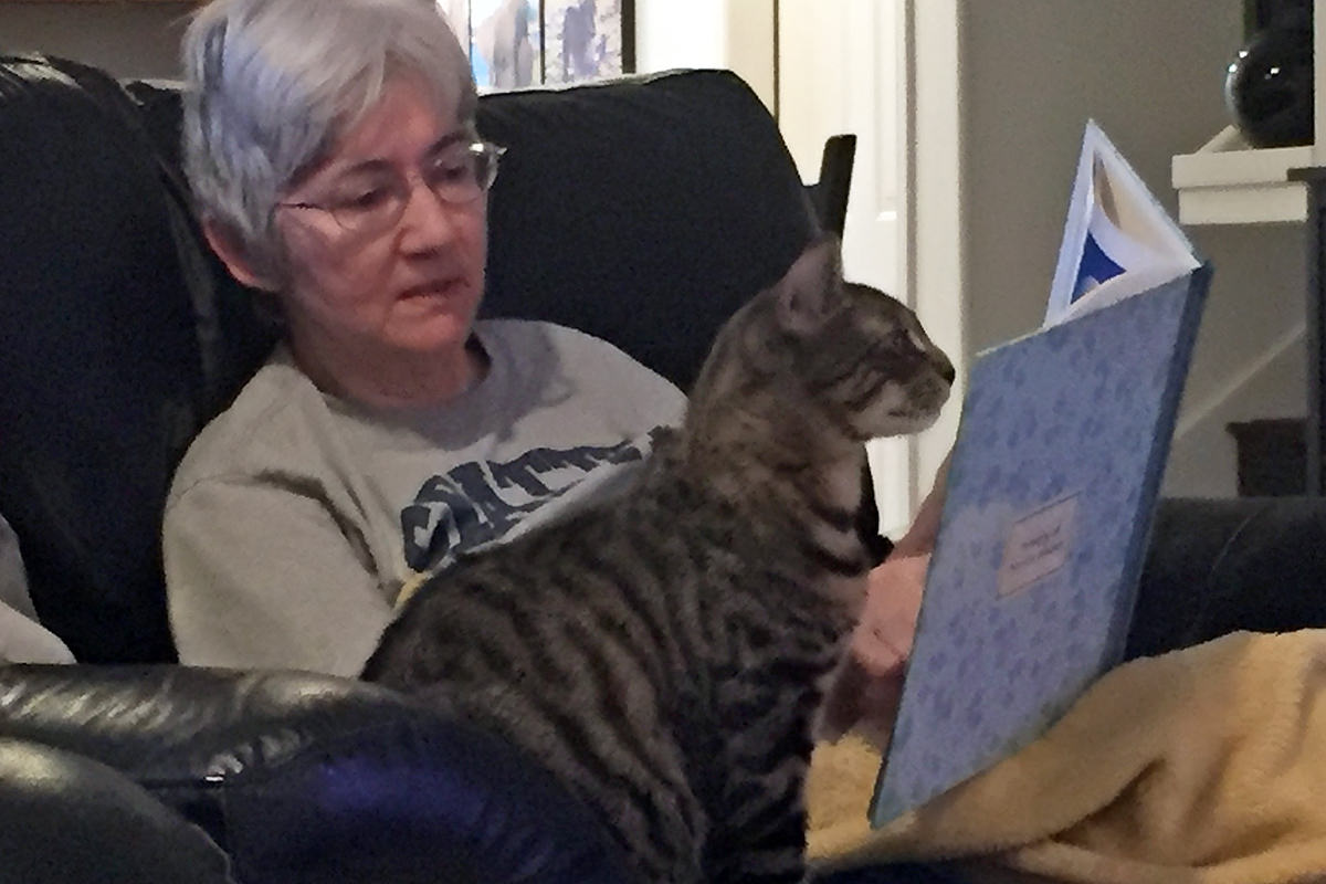 Mom Reading Her Travel Book with Jake!
