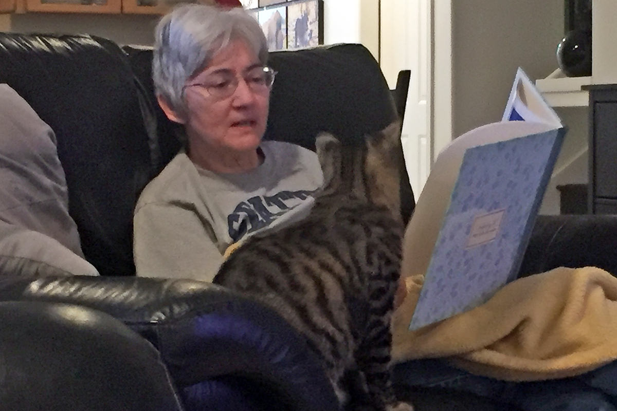 Mom Reading Her Travel Book with Jake!