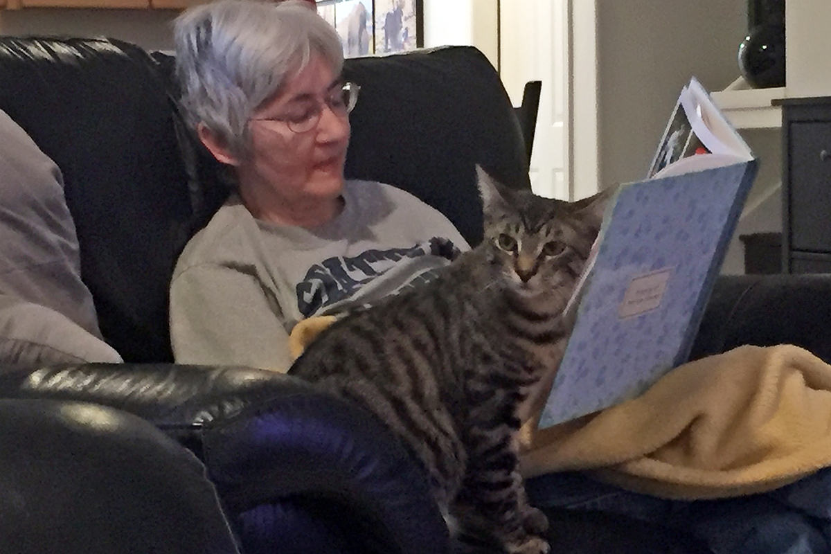 Mom Reading Her Travel Book with Jake!