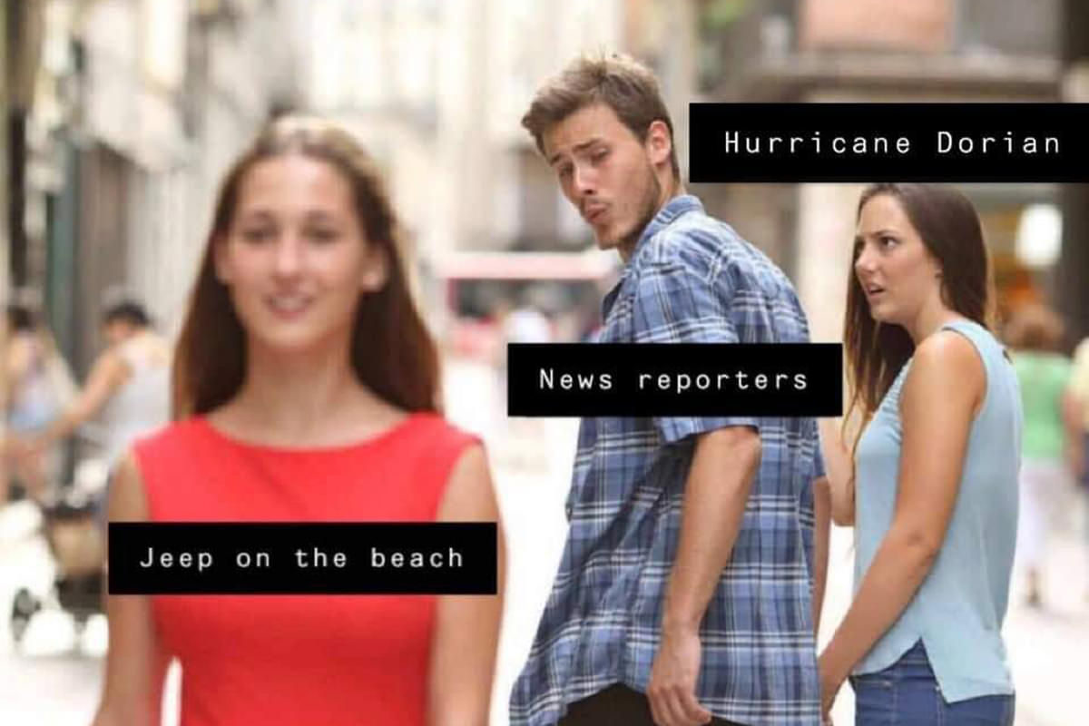 A guy labeled NEWS REPORTERS is ignoring a woman labeled HURRICANE DORIAN and staring at a pretty woman labeled JEEP ON THE BEACH as she walks by.