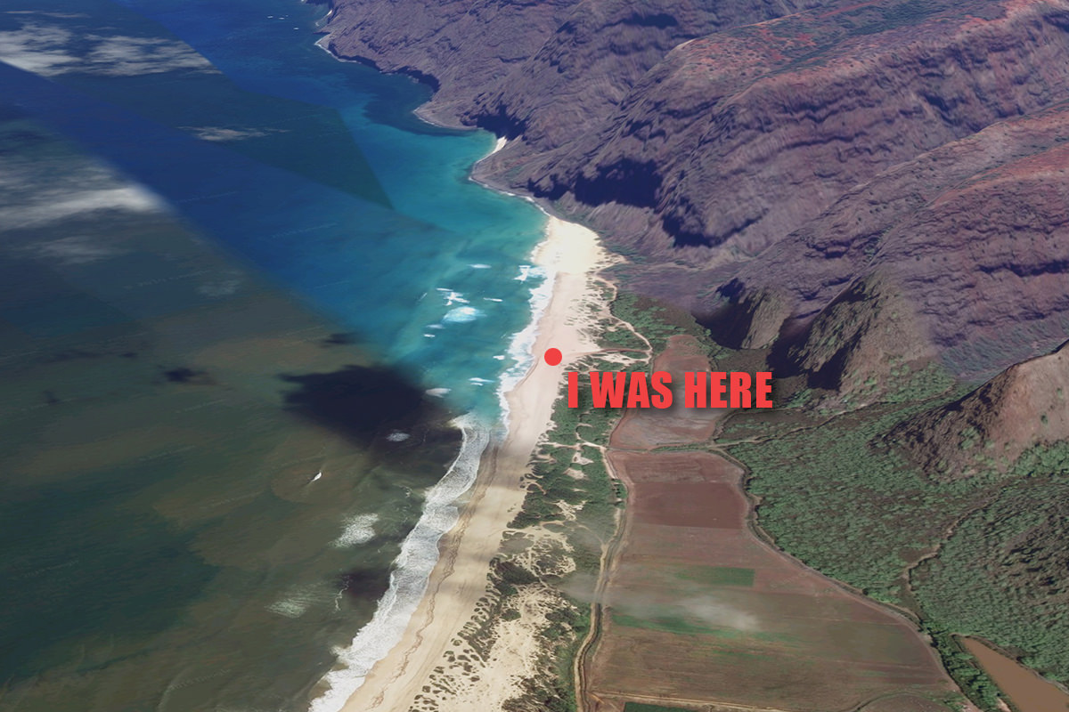 A satellite view looking down at Polihale Beach with pretty water and a looming cliff in the distance.