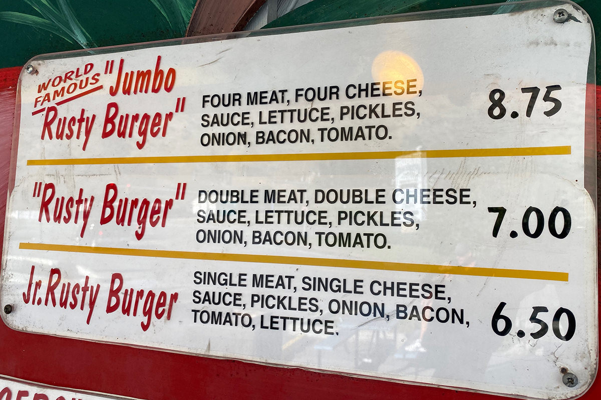 Jumbo Rusty Burger: Four meat, four cheese, sauce, lettuce, pickles, onion, bacon, tomato.