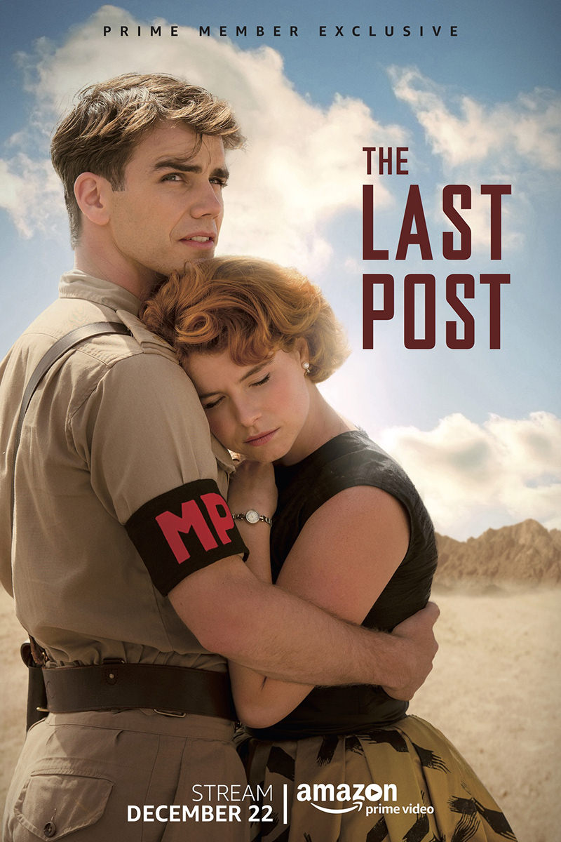 A poster for The Last Post showing a military police officer holding on to a beautiful woman in the dessert.