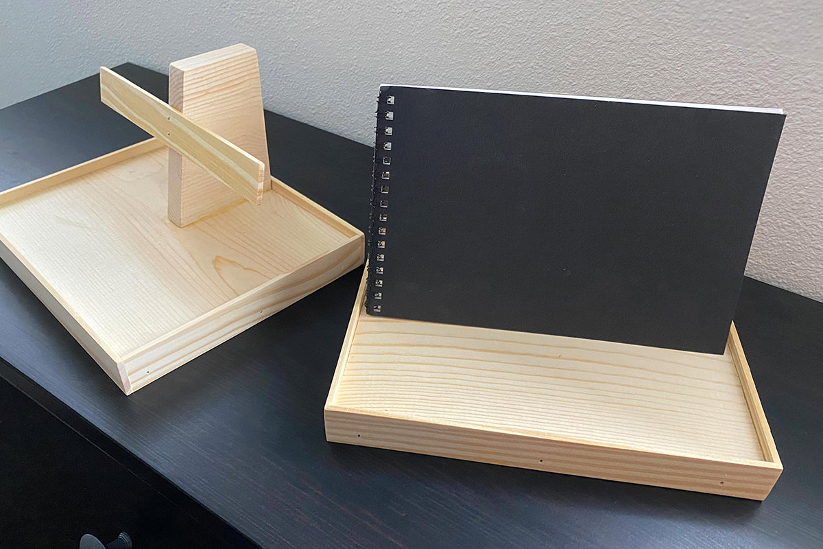 Wooden display stands for small booklets.