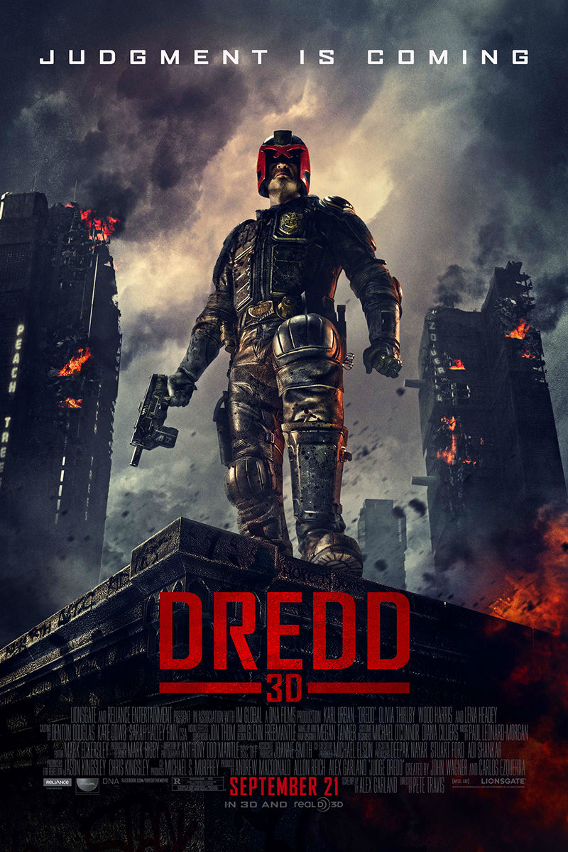 Dredd movie poster featuring Judge Dredd standing on top of a building while a city is errupting in destruction and flames.