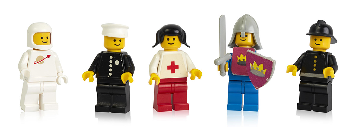 An assortment of LEGO minifigures lined up.