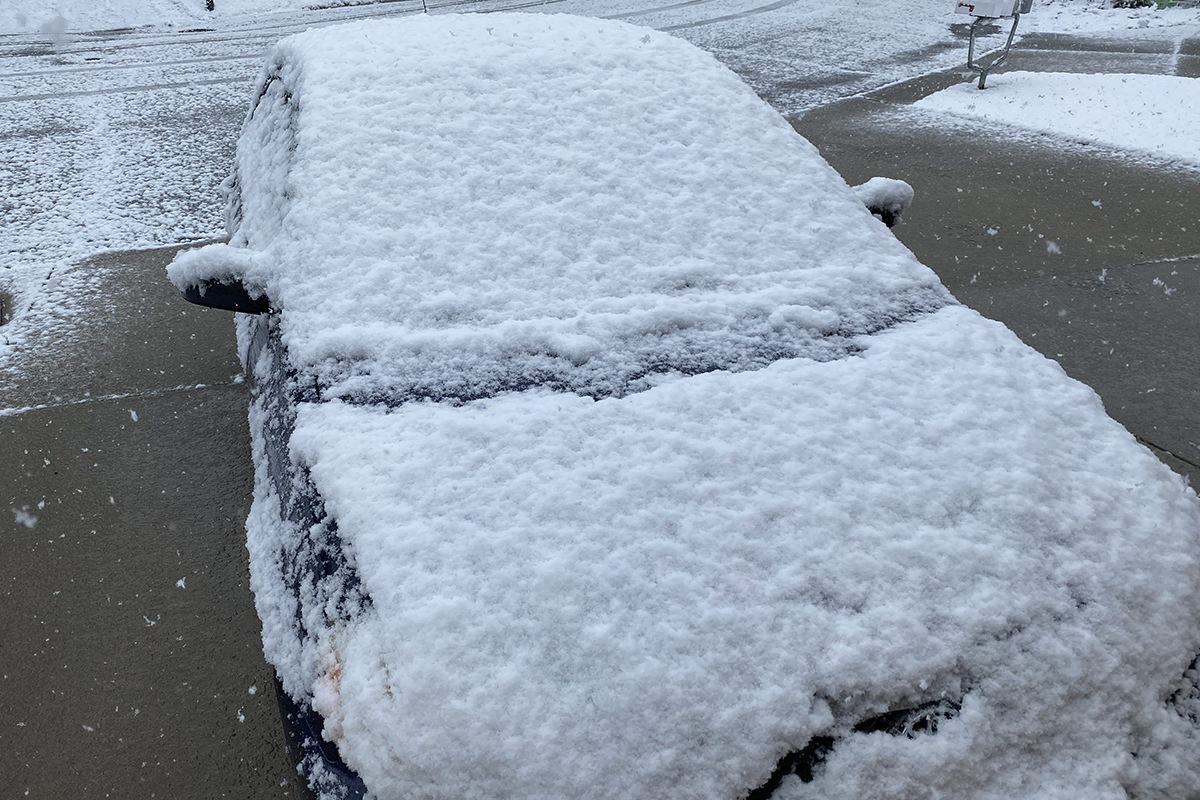 A shit-load of snow piled on top of my car.