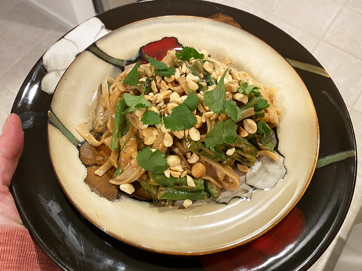 My dinner. It's a plate of rice pasta with spicy peanut sauce and blackened zuccini and green beans with cilantro and peanuts.