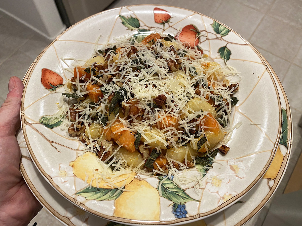 My dinner. A bowl of gnocchi and sweet potato with crisped sage, peans, and parmesan on top.