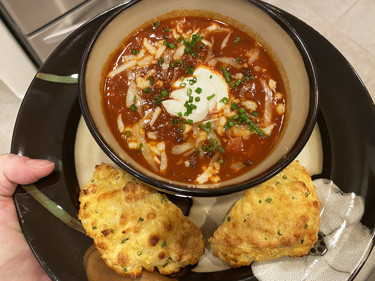 My dinner. It's a bowl of black bean soup with sour cream and chives pluse a cheddar biscuit.