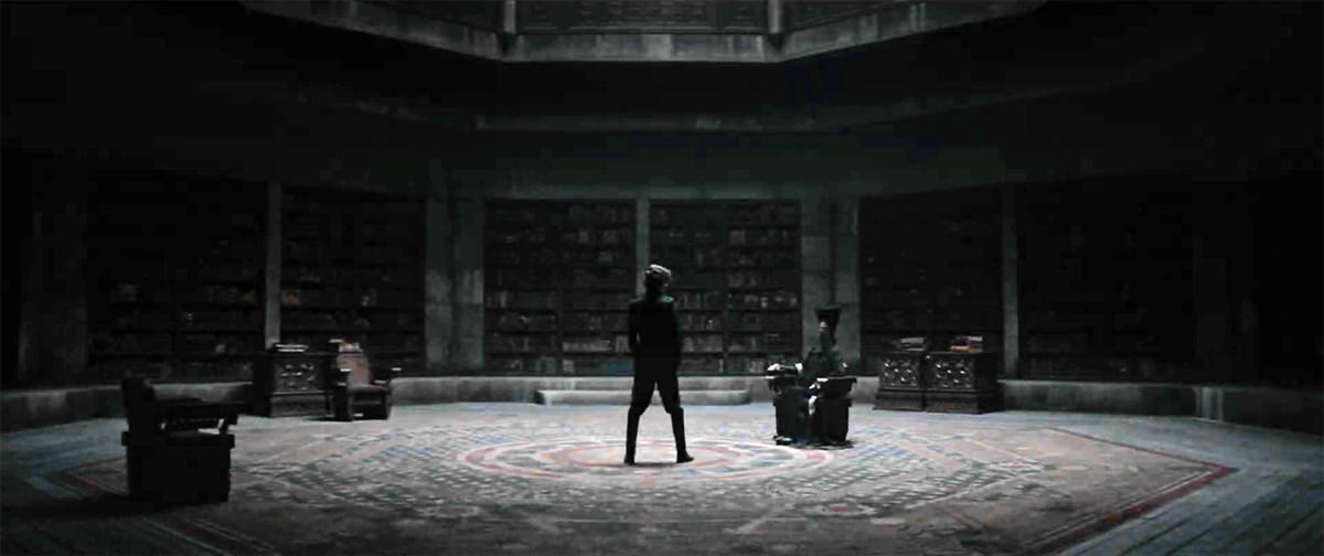 A massive stone study with books lining the walls. Paul is facing down the Reverend Mother who is seated with a box at her hand.