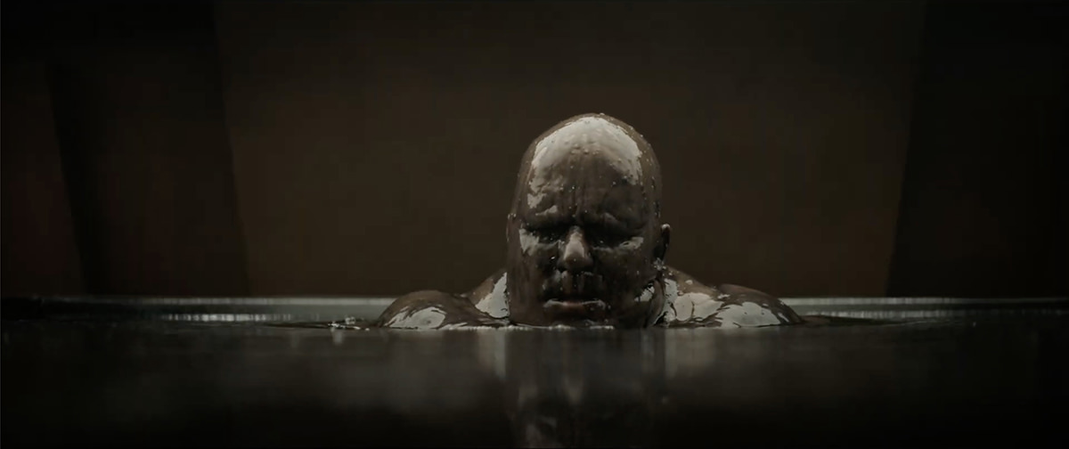 Stellan Skarsgård as Baron Vladamir Harkonnen, rising from the mud.