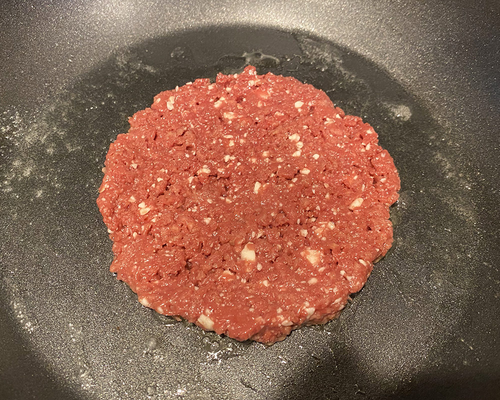 An uncooked Impossible Burger in my Skillet.