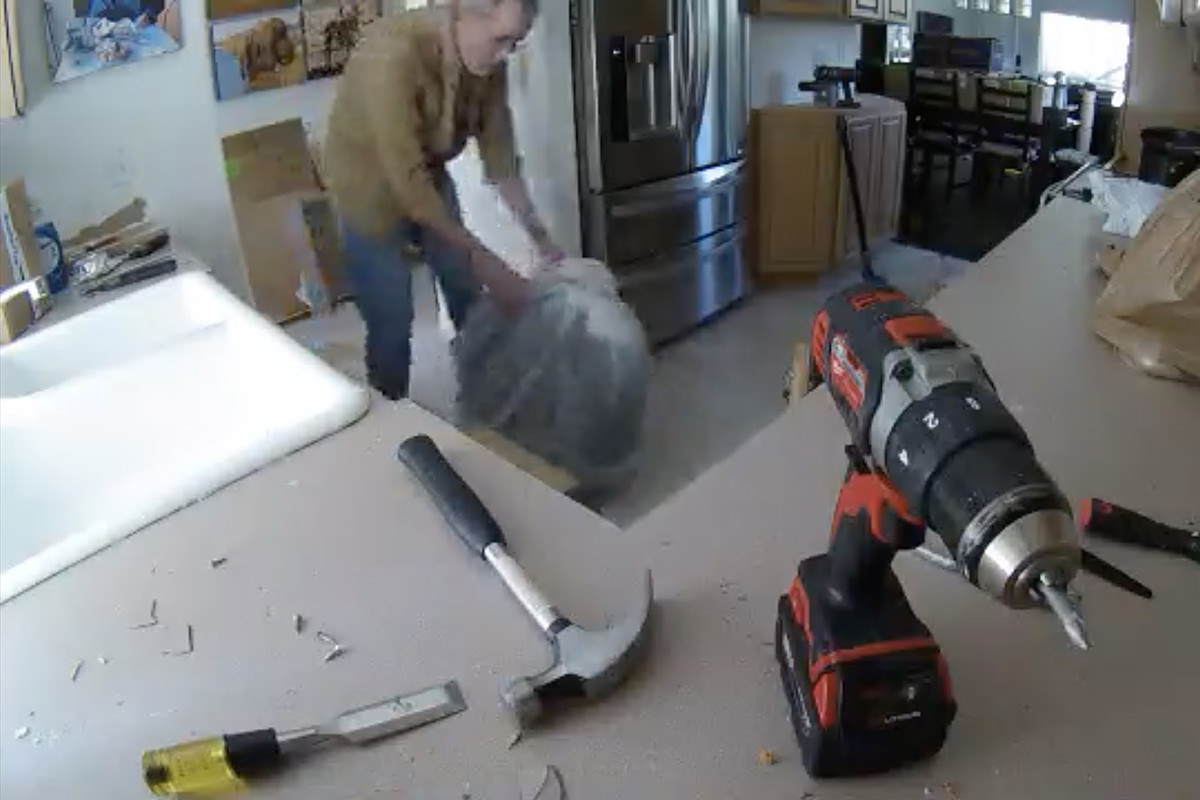Me rolling a snow tire into my kitchen.