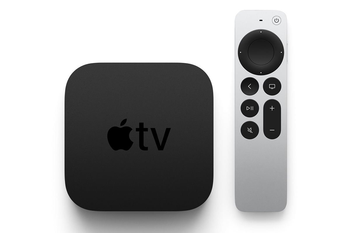 Apple TV remote in the hand.