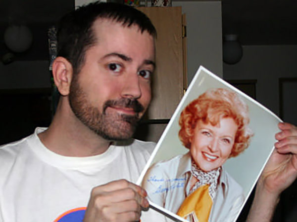 Me with an autographed photo of Betty White.