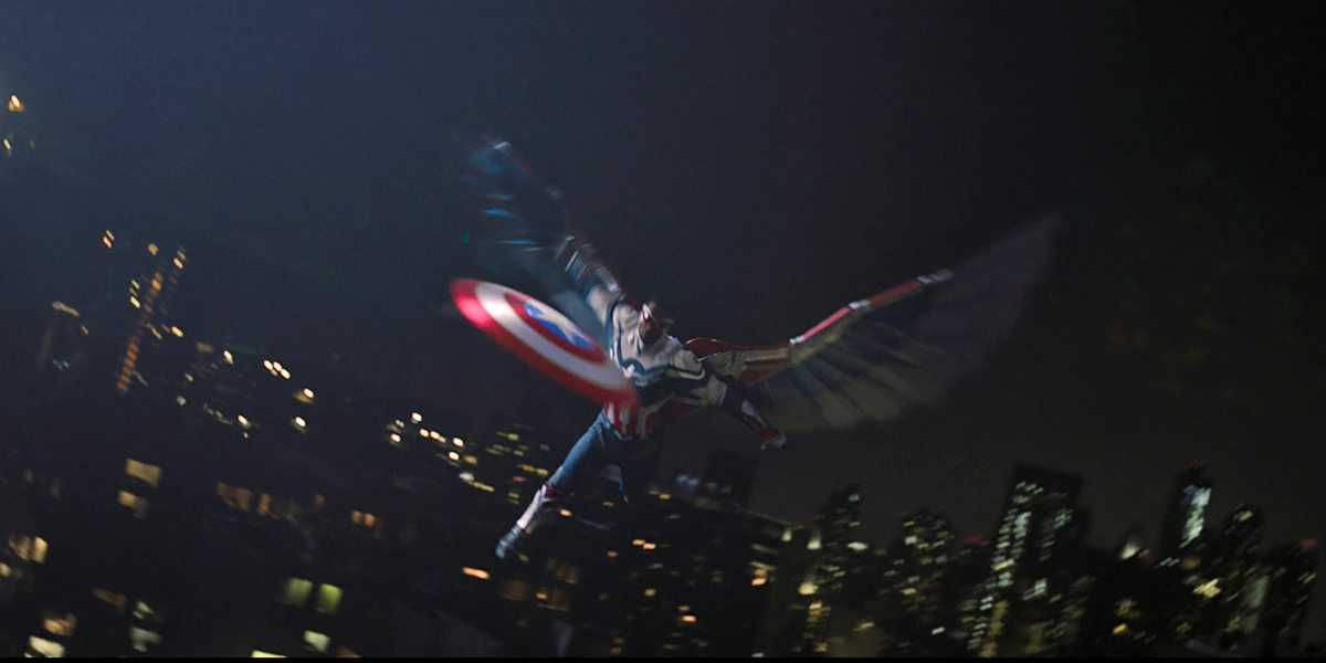 Captain America flying in the night sky, throwing his shield through a skyscraper window.