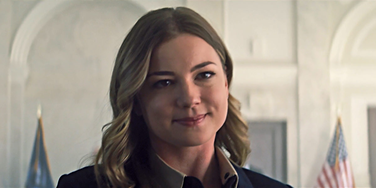 Sharon Carter walking away from her pardoning hearing with an evil smile on her face.