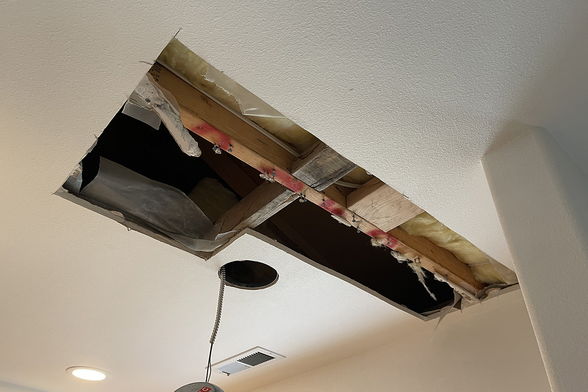 A big hole cut in my ceiling.