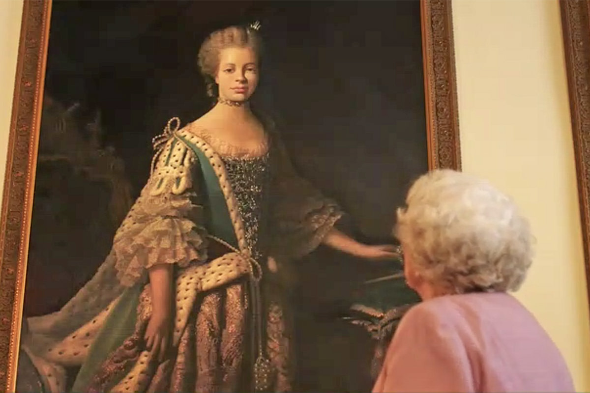 Lifetime Movie: The Queen looking up at a portrait of Queen Charlotte.