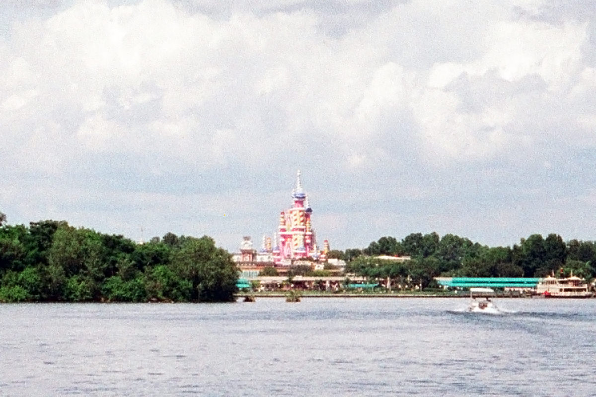 The hideous Cinderella Castle Birthday Cake all gaudy in pink and yellow.