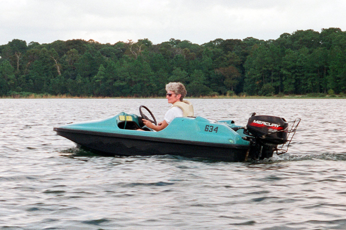 Mom in a mini speedboat.